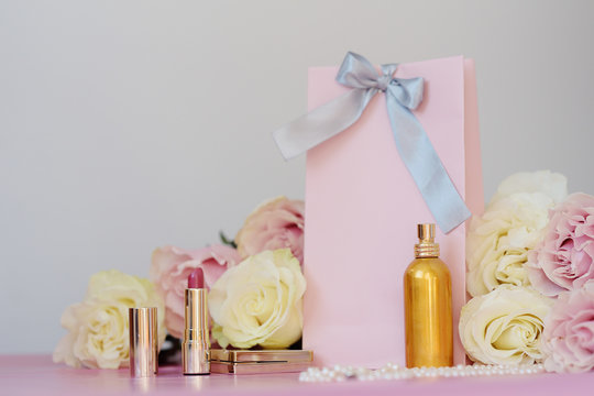 Perfume, Gift, Pearls, Gentle Roses On A Pink Background.