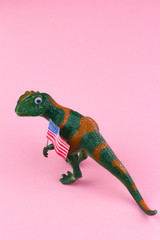 plastic funny green dinosaur with USA flag
