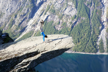 Naklejka premium man stands on his hands in Troll language. Norway
