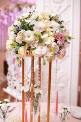 Flower table decorations for holidays and wedding dinner. Table set for holiday, event, party or wedding reception