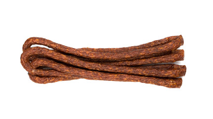 Long thin smoked sausages tied with string isolated on white