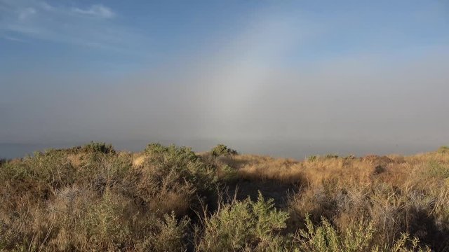 Fog moving through lemmon valley over the lake