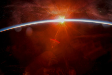 Fototapeta na wymiar Earth with eclipse on starry sky. Abstract space sunrise . Elements of this image furnished by NASA.