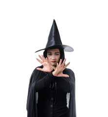 Portrait of woman in black Scary witch halloween costume standing with hat isolated on white background