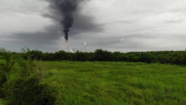 Chemical Plant Conducting Controlled Flaring to Burn Off Excess Materials in Channelview near Houston, Texas Filmed by Drone