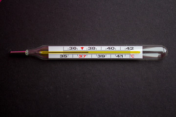 a termometr with high temperature on a black background