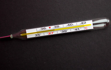 a termometr with high temperature on a black background with
