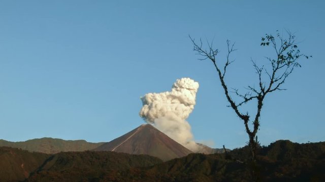 Reventador Volcano erupting in the early morning, September 2016. The mountain is situated in a remote part of the Ecuadorian Amazon surrounded by rainforest. 