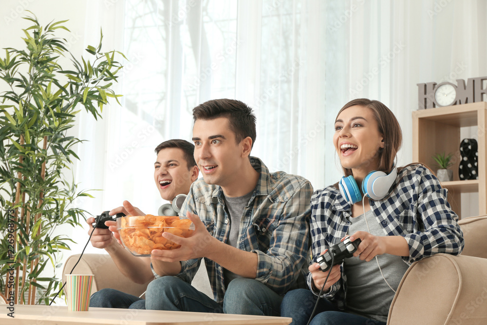 Poster young people playing video games at home