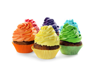 Delicious colorful cupcakes on white background