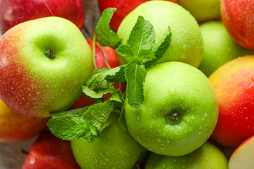 Ripe fresh apples with mint, closeup