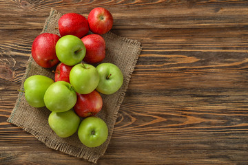 Fresh ripe apples on wooden table