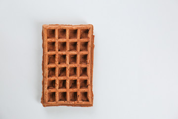 Delicious waffle on light background
