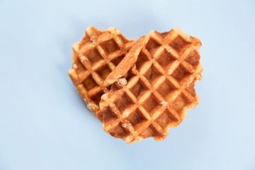 Delicious waffles on light background