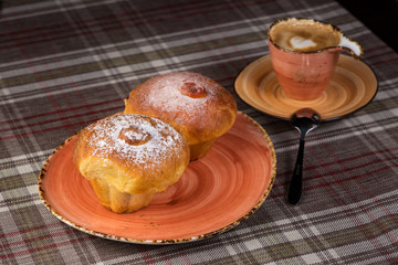 donuts with powdered sugar on plate