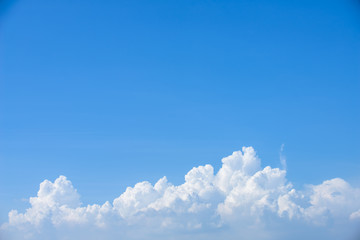 Rain clouds forming with blue sky background