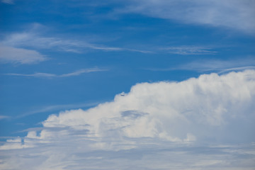 Rain clouds forming with blue sky background