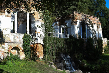 Old wall with waterfall in the park