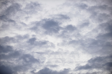 Rain clouds forming with blue sky background
