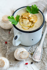 Mushroom soup with fried mushrooms and shallots.