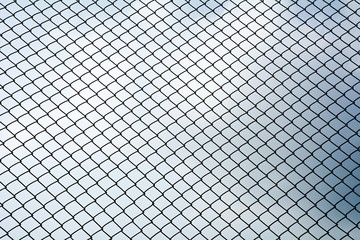 Fototapeta premium Texture the cage metal net isolate on blue sky background