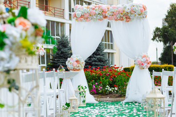 Arch for the wedding ceremony, decorated in delicate colors