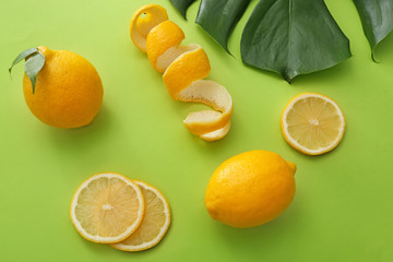 Composition with fresh ripe lemons on color background