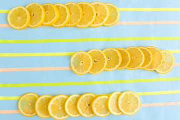 Flat lay composition with lemon slices on color background