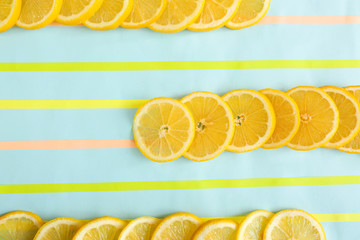 Flat lay composition with lemon slices on color background