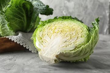 Cut savoy cabbage on grey table