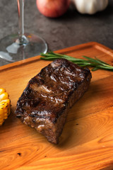 Grilled beef steak with spices on cutting board
