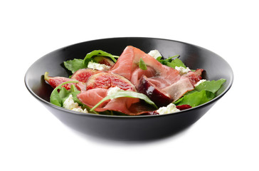Plate with delicious fig salad on white background