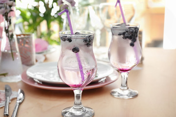 Glasses with delicious summer cocktail on table