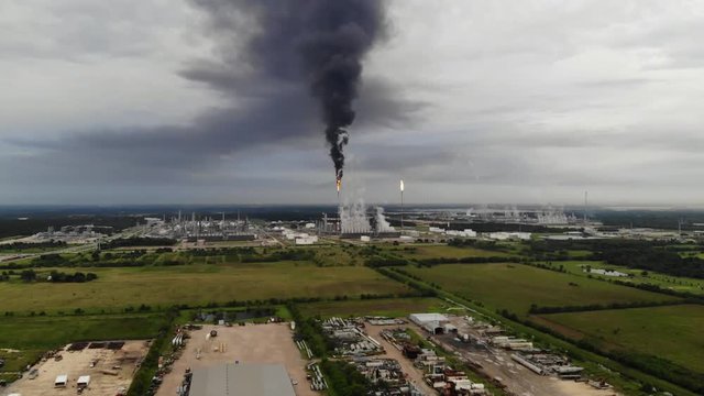 Chemical Plant Conducting Controlled Flaring to Burn Off Excess Materials in Channelview near Houston, Texas Filmed by Drone