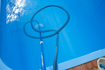 Fototapeta na wymiar vacuum cleaner for the pool, clean up and care for the bottom of the pool. collect, absorb garbage and dirt. automatically takes away particles from the bottom and sides of the vacuum
