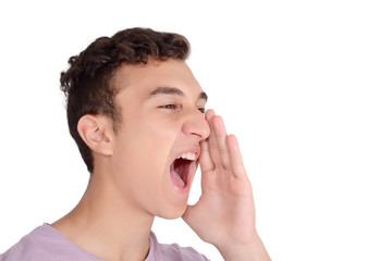 Portrait teen boy screaming with wide open mouth