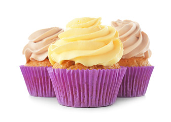 Delicious cupcakes on white background