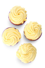 Delicious lemon cupcakes on white background, top view