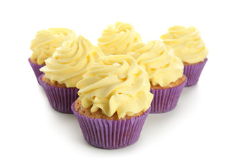 Delicious lemon cupcakes on white background