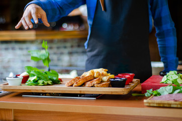 Chef is breakfast preparing in the restaurant