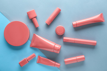 Set of pink decorative cosmetics on color background