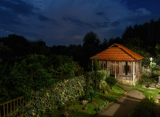 lighted bungalow at sunset