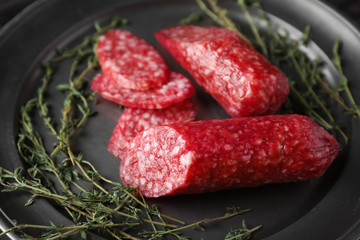 Metal tray with delicious smoked sausages, closeup