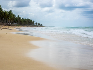 beautiful caribbean beach on a cloudy day