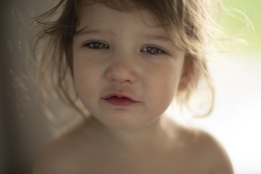 portrait of sad little girl, uspet toddler