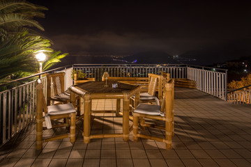 Chairs and table on the terrace overlooking the Bay of Naples and  Vesuvius. Sorrento. Italy