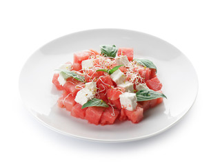 Plate with delicious watermelon salad on white background