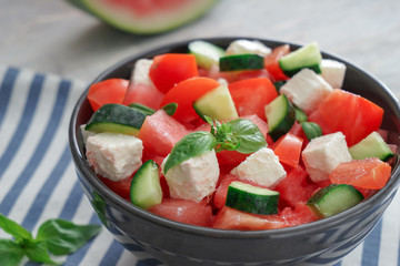 Bowl with delicious watermelon salad on table, closeup