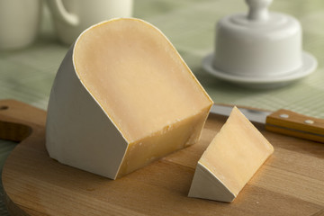 Piece of mature white organic goat cheese