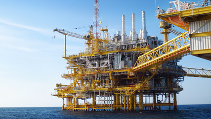 Oil and gas industry and hard work. Offshore construction platform for production oil and gas,Production platform and operation process by manual and auto function, oil and rig industry and operation.